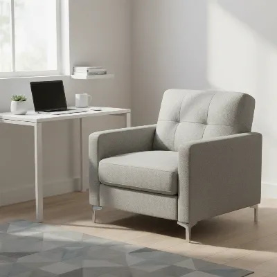 Compact twin sleeper sofa chair in a modern tiny home office, day mode, with a desk nearby.